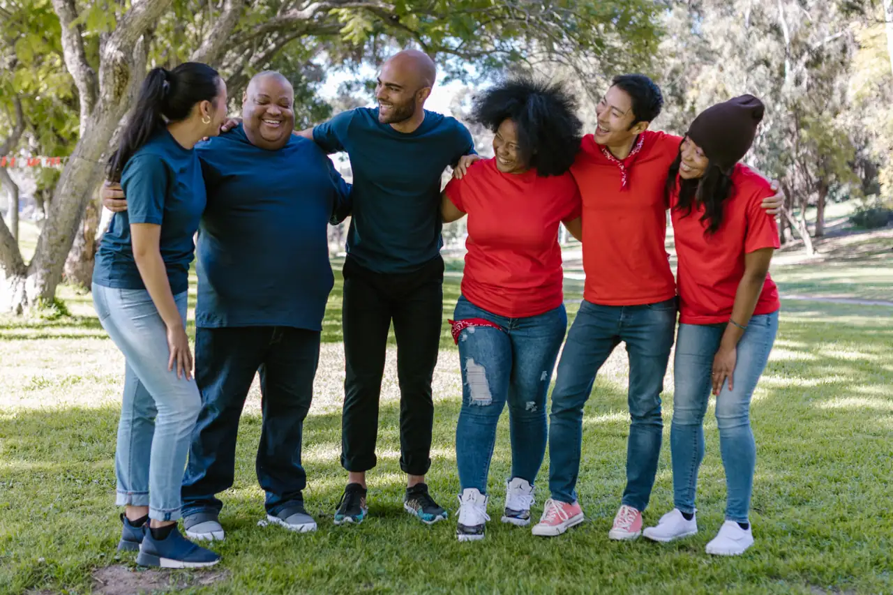 A diverse group standing together outdoors
