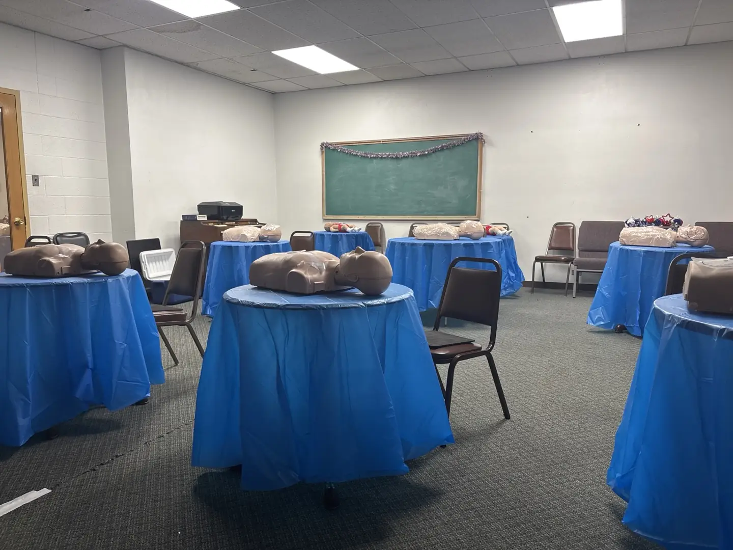 CPR manikins arranged on individual tables in GAP's training room
