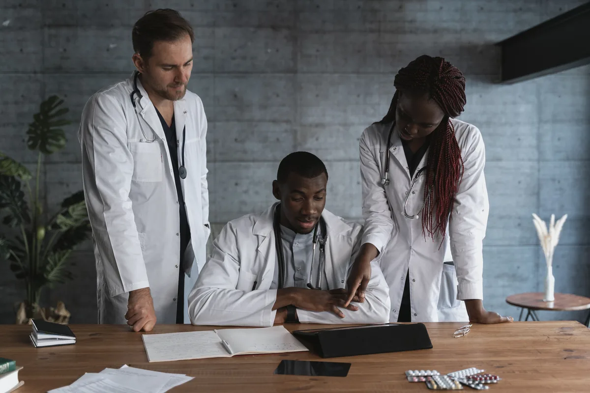 Healthcare professionals reviewing information together at a table